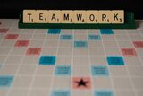 "Teamwork" aus Buchstaben gelegt 